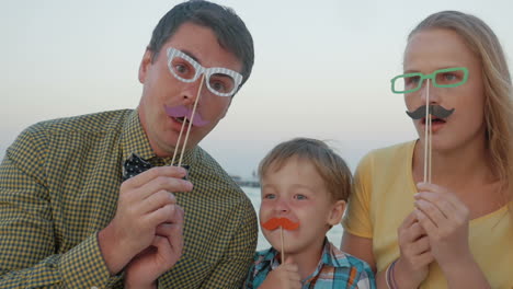 family of three with hipster glasses and moustache