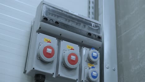 industrial sockets and plug on distribution board. factory site electricity