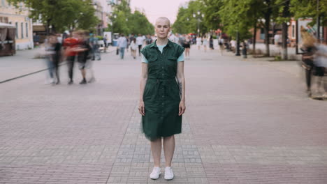 woman in a green dress on a city street