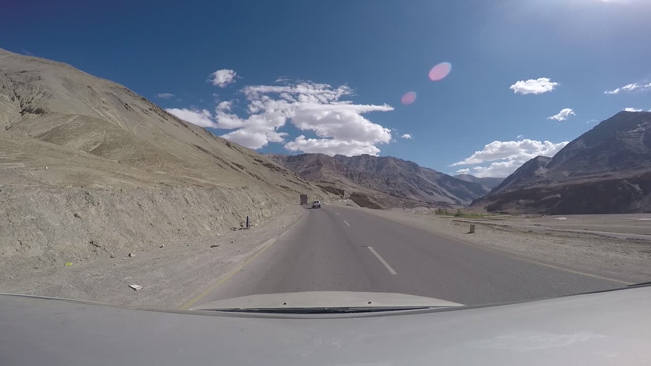Driving through Ladakh region in India. Arid landscape with mountains.