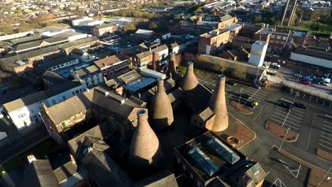 aerial view of the famous bottle kilns of gladstone pottery museum, formerly used in manufacturing in the city stoke on trent, staffordshire, industrial decline, poverty and cultural demise