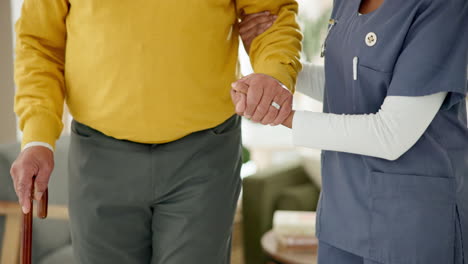 caregiver assisting elderly man with walking