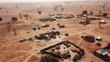 Rural-nomadic-village-in-Nigeria,-West-Africa---aerial-reveal