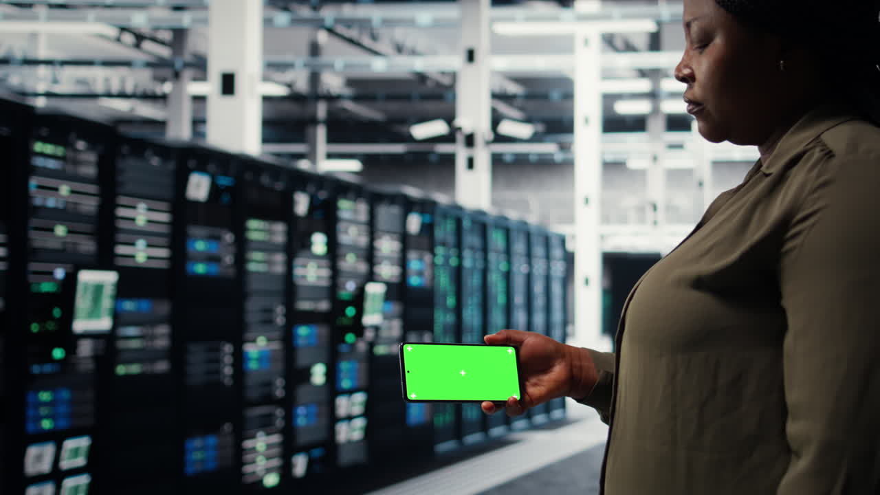 Server hub software developer uses green screen smartphone