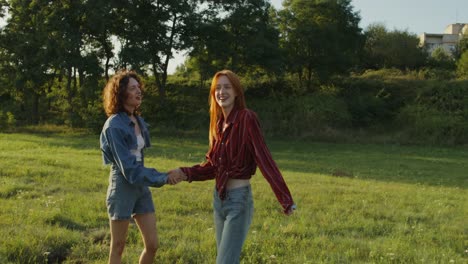 two friends having fun in a field