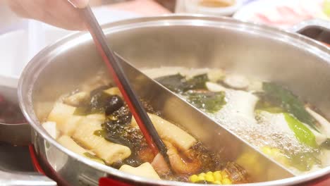 preparing hotpot with fresh ingredients in bangkok