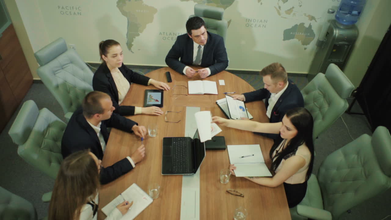 Business Partners Planning Work. Businessman and businesswoman meeting in modern office