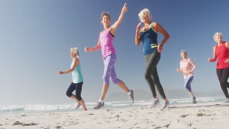 senior women running on the beach