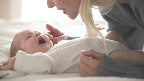 Woman-holding-and-kissing-a-baby