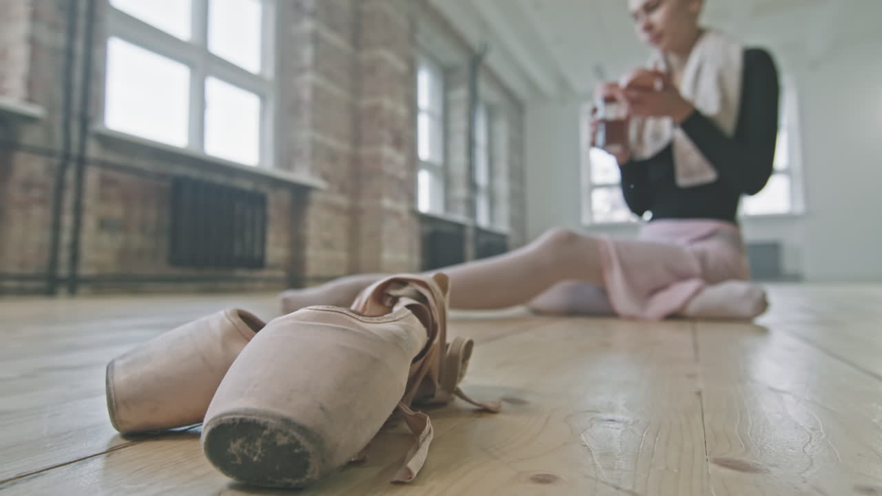 Ballet Shoes On Wooden Floor