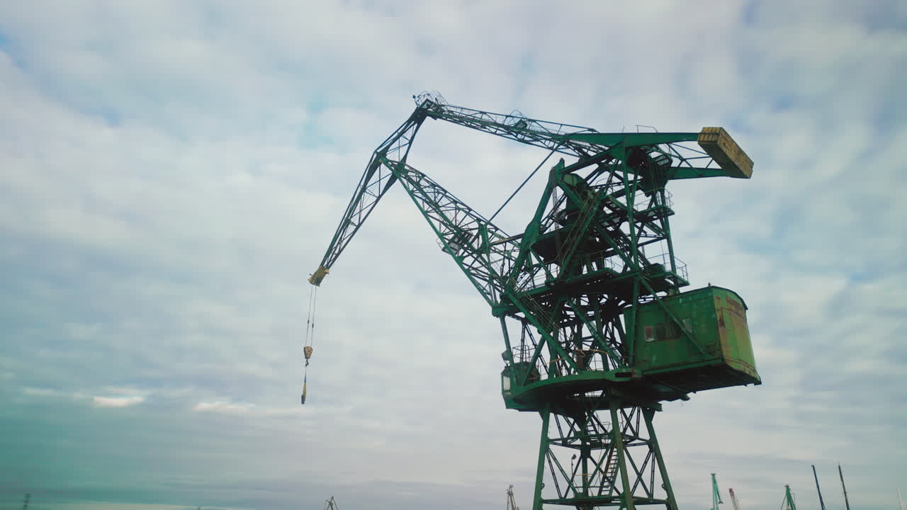 Industrial Crane Against Cloudy Sky