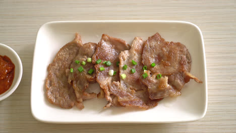 grilled pork neck sliced on plate in asian style