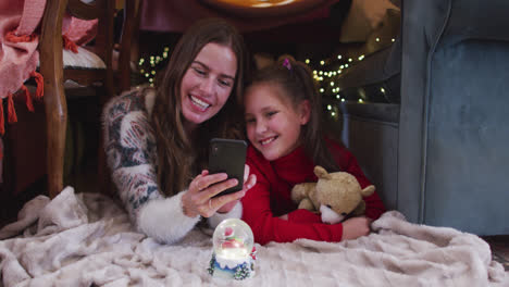 Caucasian-mother-and-daughter-taking-a-selfie-on-smartphone