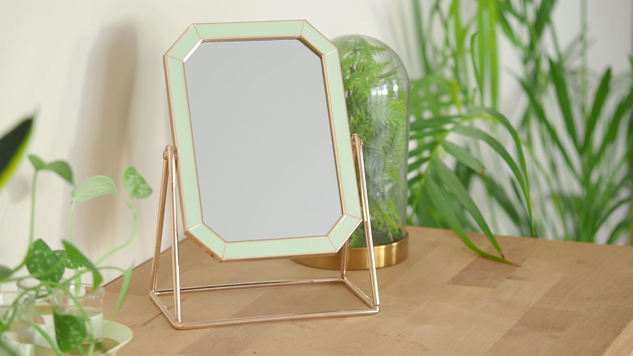 Modern Vanity Mirror with Gold and Green Frame on Wooden Desk