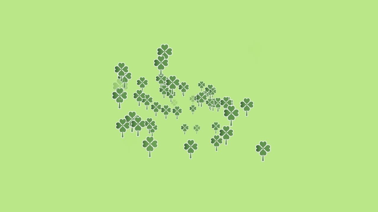 초록색 배경 위에 여러 개의 움직이는 클로버의 애니메이션