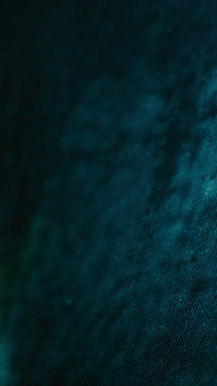 View through Translucent Fabric Revealing Light Shining through Darkness