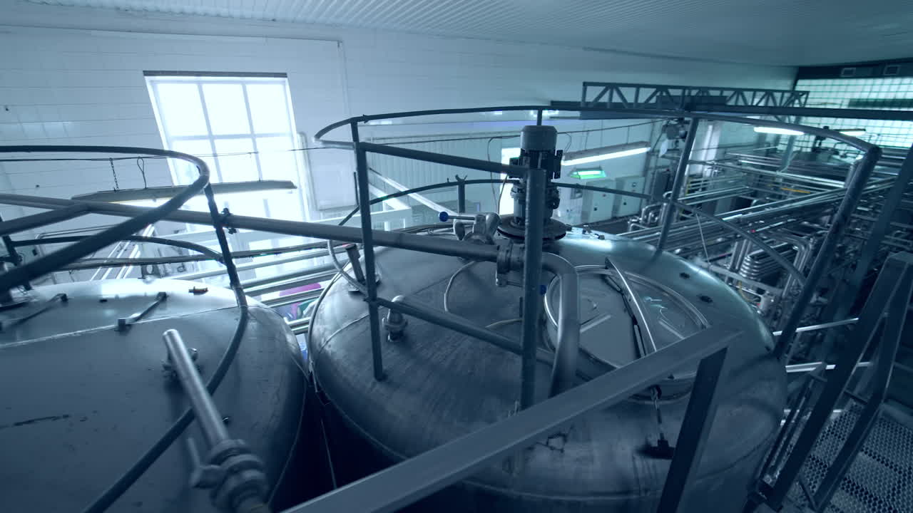 Milk production plant. Milk production technology in a large specialized farm. Agriculture production factory. Modern equipment on dairy plant.