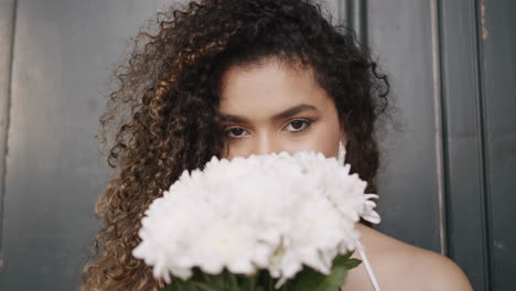 woman holding a bouquet of white flowers