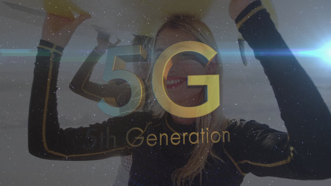 5G technology text animation over smiling person holding yellow object