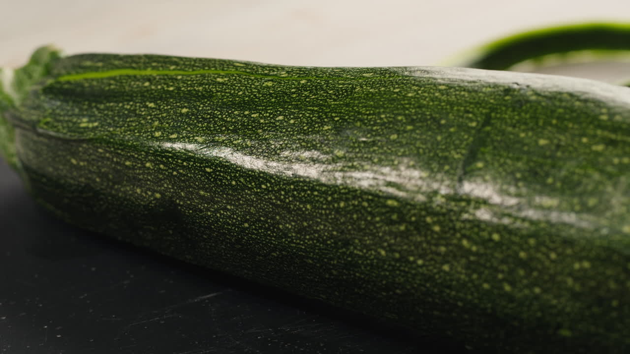 Close-up of a zucchini being prepared