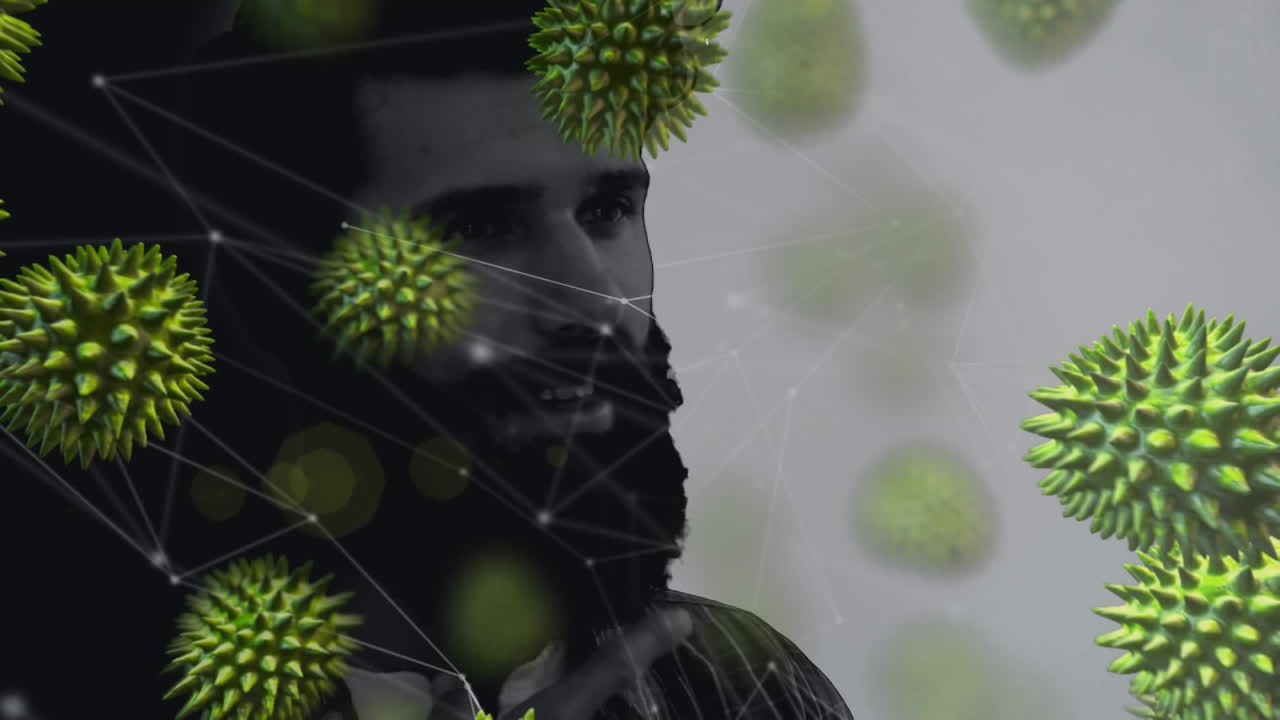 animación de un hombre biracial frotando su barba sobre células de covid-19 flotando.