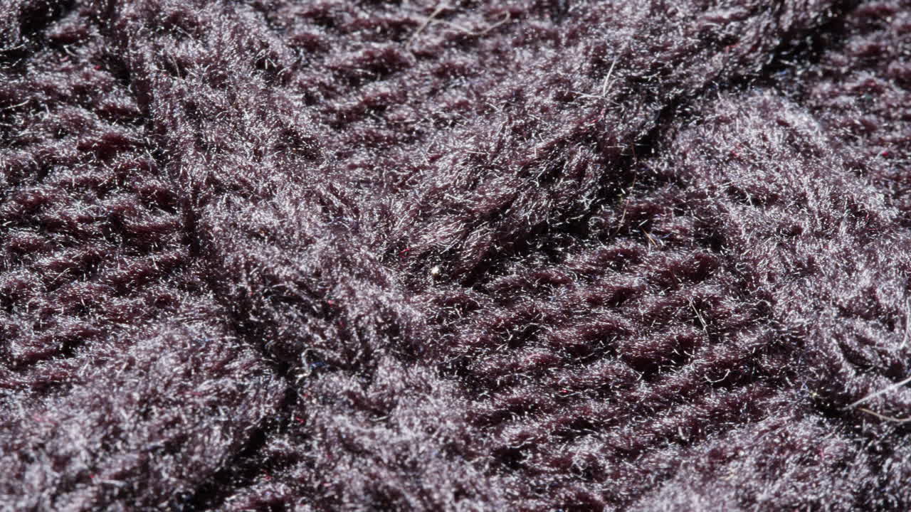 Close-up view of dark gray knitted fabric