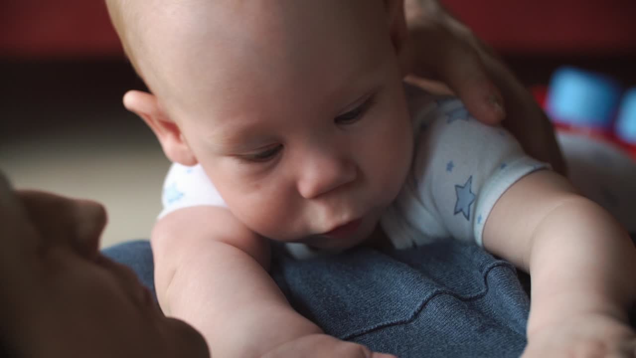 Close-up of a baby with a parent