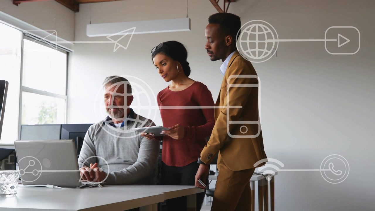 Woman tapping tablet man typing colleague leaning in Wi-Fi icons popping on laptop team deciding IT