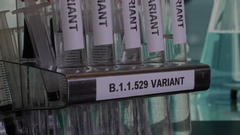 close up view of tubes containing new varient of corona virus- b.1.1.529, known as omicron which is currently the centre of most of the research work going on in labs throughout the world.
