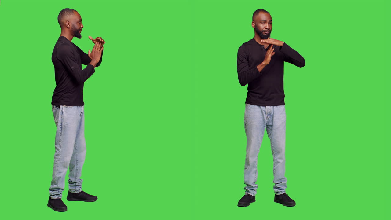 Man on green screen making time out sign