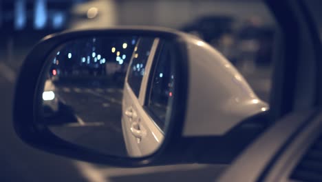 the reflection of car motion in side mirror