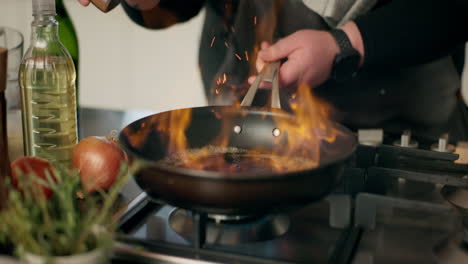 chef flaming a pan