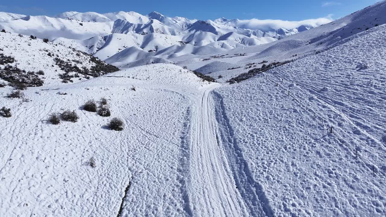 Beautiful winter landscape of New Zealand, fresh snow, countryside, mountain range on horizon