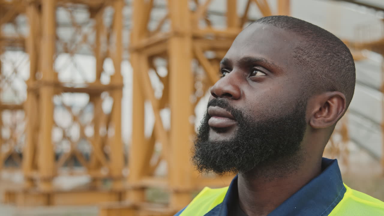 Construction Worker in Noise-Canceling Earmuffs