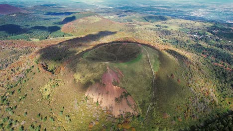 aerial view of puy de pariou, a stunning young volcano in lush landscape