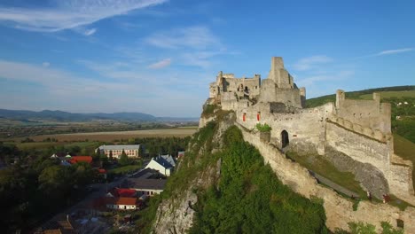 astonishing aerial view of an abandoned castle ruin on a hilltop in slovakia