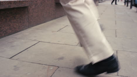 contemporary funky caucasian businessman street dancer dancing freestyle in the city