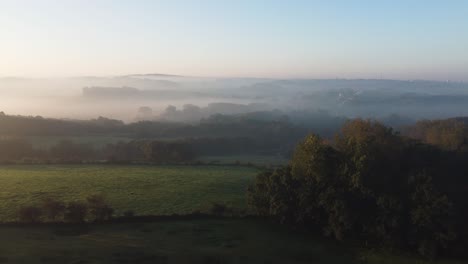 panoramic view of a misty landscape of hills and fields in wimereux, pas-de-calais, france. aerial shot with drone. fly-over droneshot