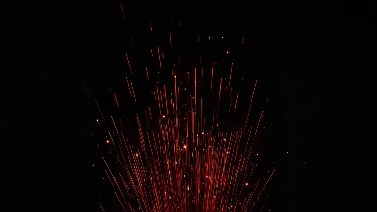 Erupting central red spark fountain shooting up streaks, peaking then fading in dark, from base