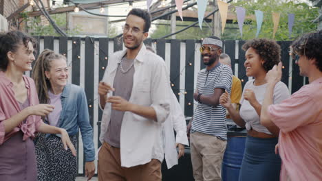 friends dancing at a backyard party