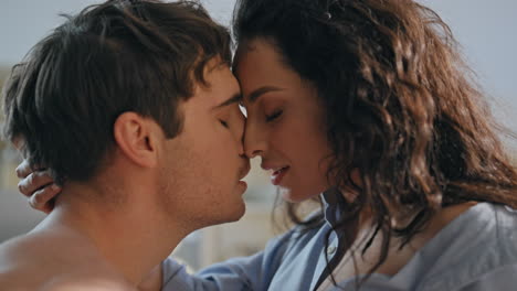 sexy family embracing home feeling desire close up. passionate couple intimacy