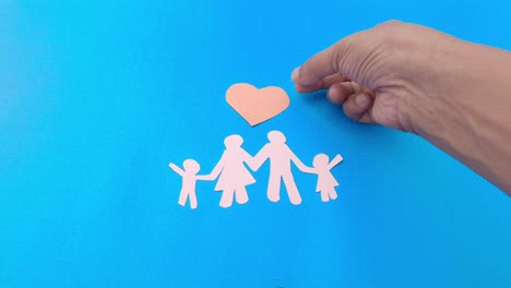 hand adding love on happy family. we are together. happy family and love heart sign on blue background. travel holiday vacation tourism design concept.