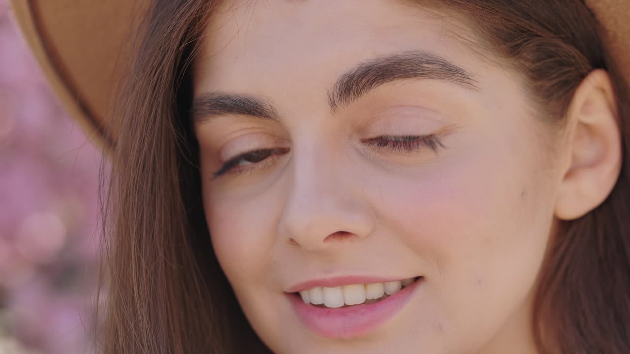Woman Smiling in Spring Flowers