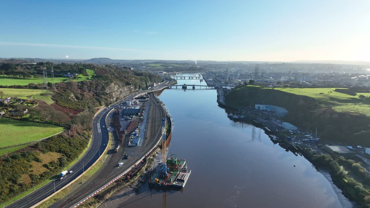 Waterford City transport links railway station and road link to motorway with traffic early morning