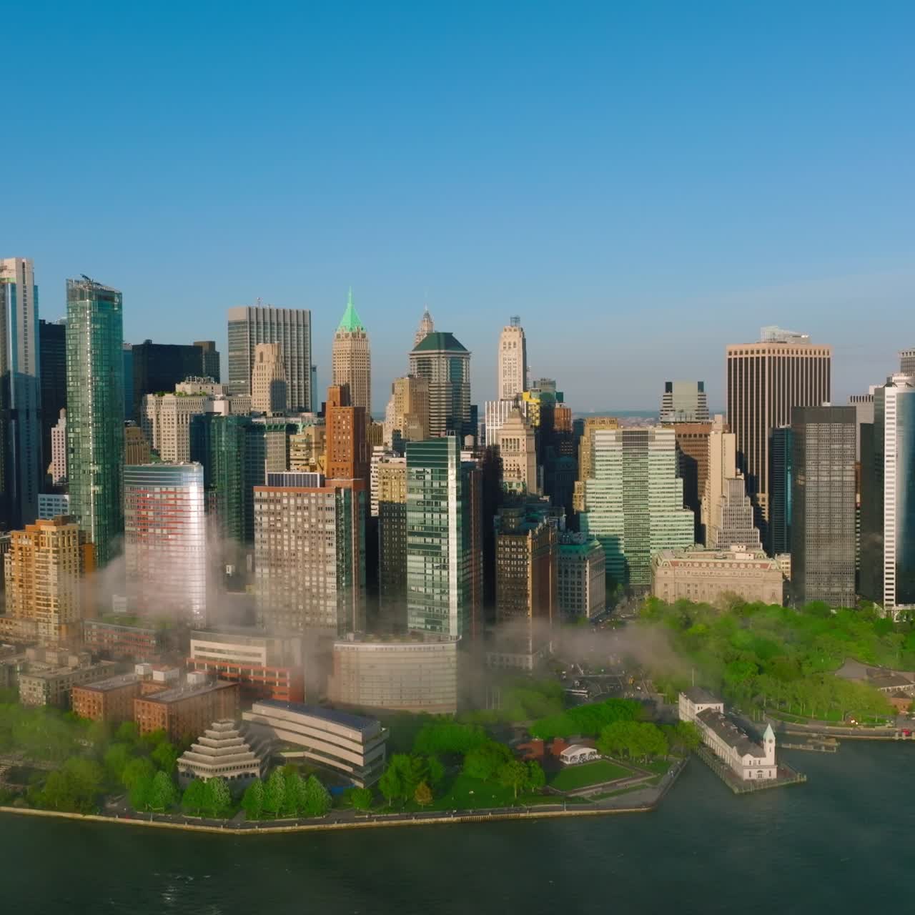 Sunny picture of beautiful Manhattan Island. Amazing buildings of outstanding New York architecture