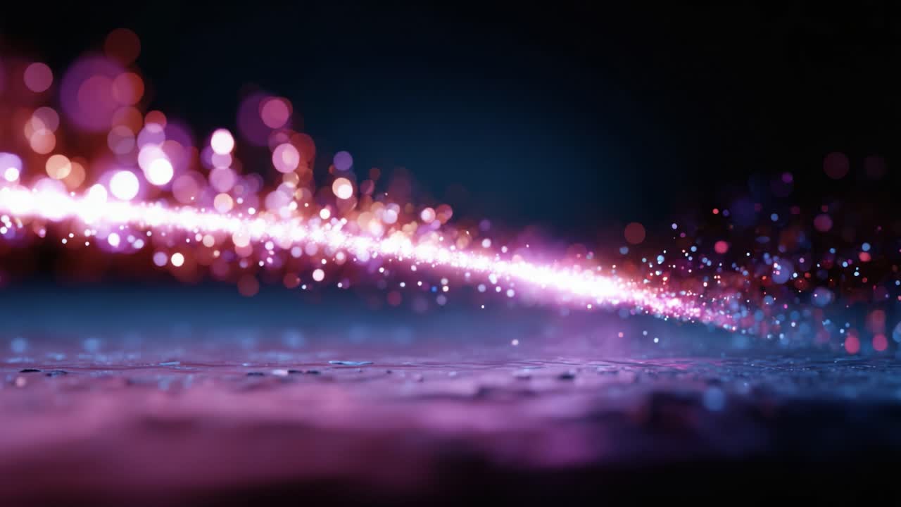 Un'affascinante esposizione di luci colorate ed effetti bokeh crea un'atmosfera vivace, mettendo in mostra la bellezza di modelli astratti e dinamiche fluide in movimento.