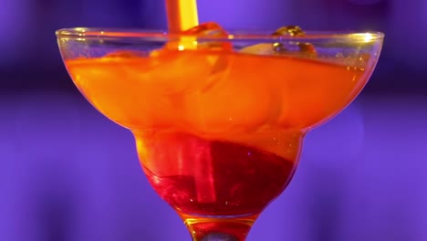 colorful cocktail being prepared