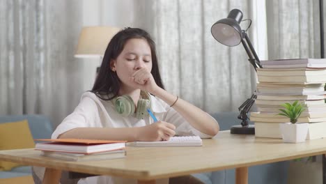 student studying and sleeping at desk