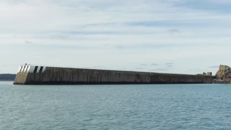 the long ancient marine wall of jersey - wide shot