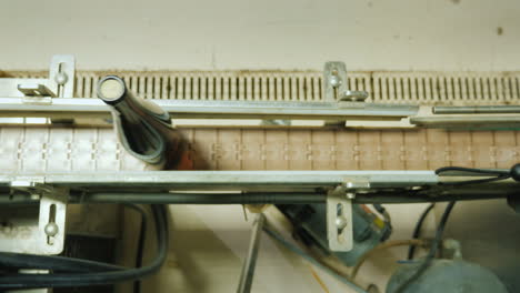 wine bottles closed with a cork stopper move along the conveyor belt view from above